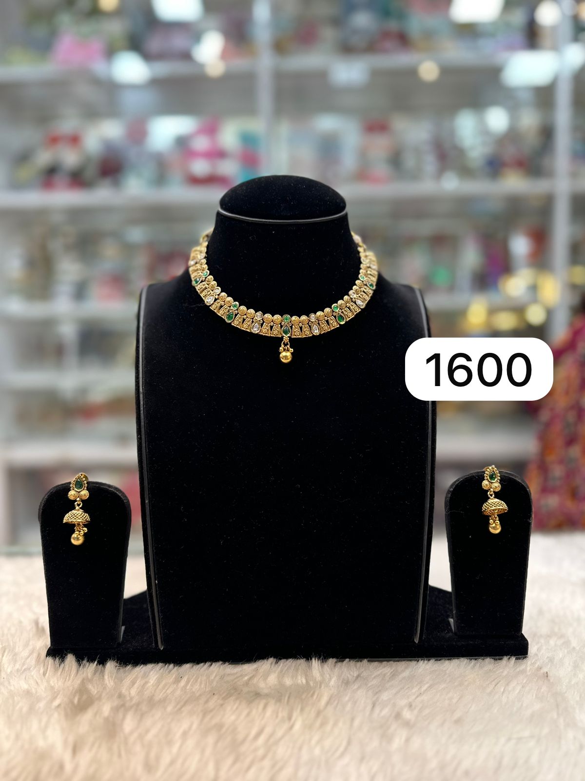 Elegant Golden Silk Set with Green Kundan