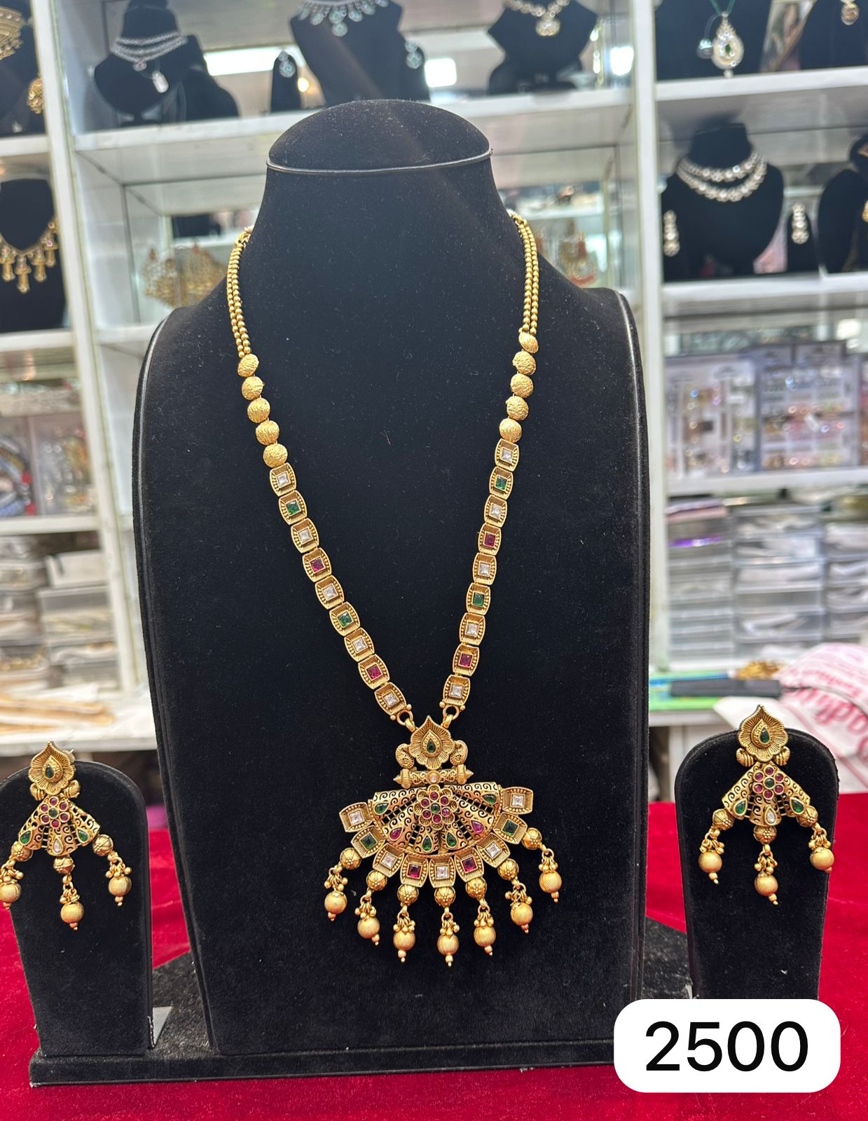 Real Look Golden Pendant Set with Green & Ruby Stones