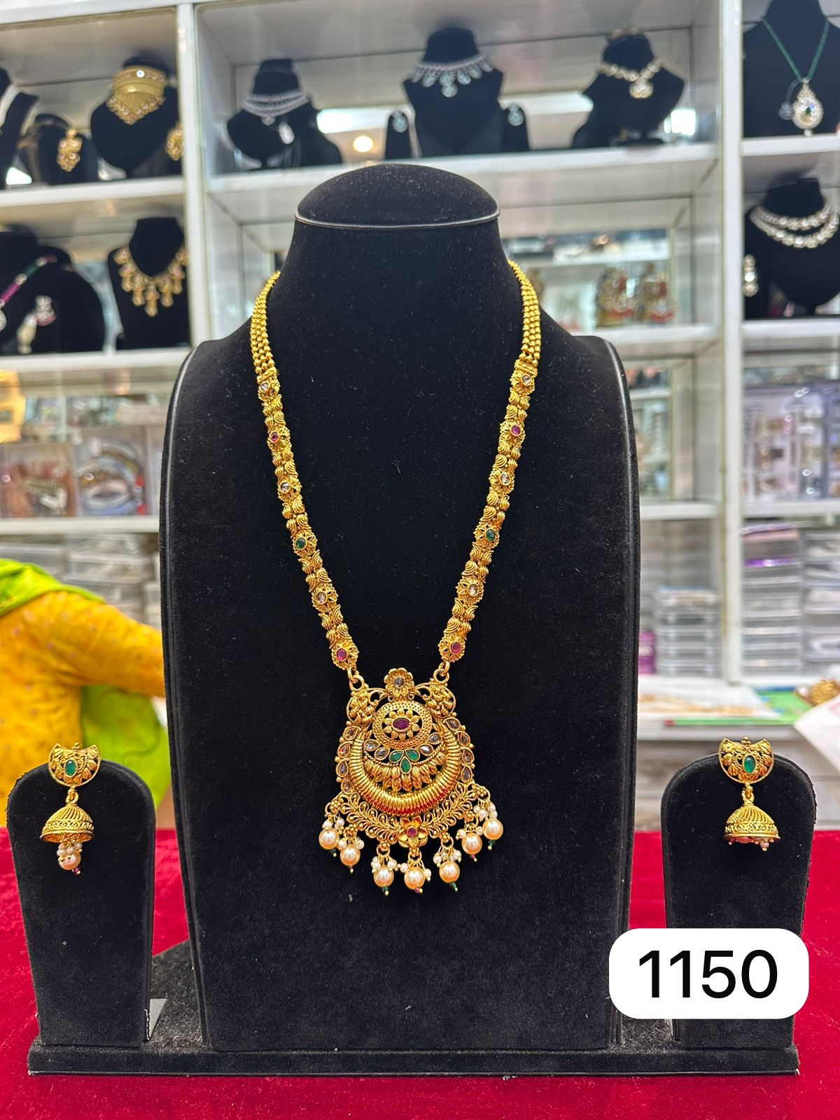 Real Look Golden Polki Pendant Set with Green Ruby Stones