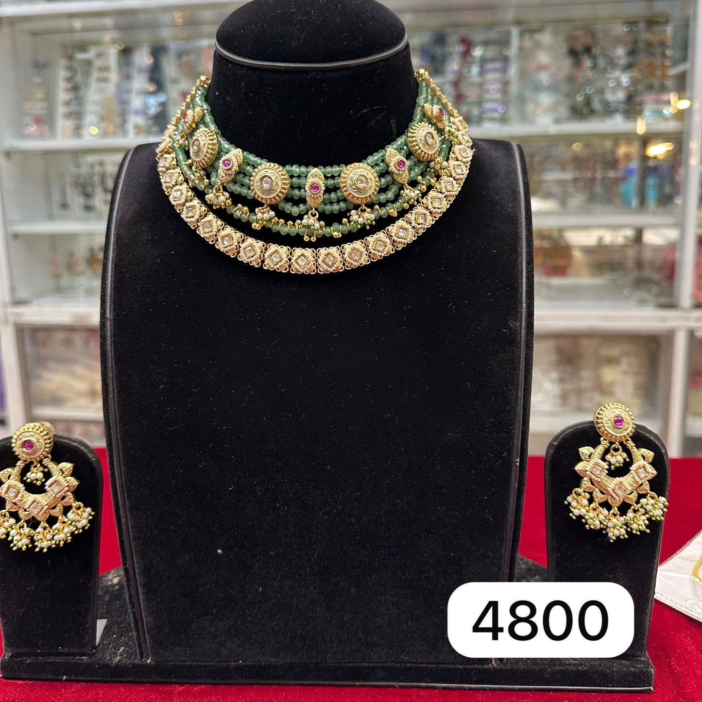 real‑look, gold-tone moti (pearl) layered set with