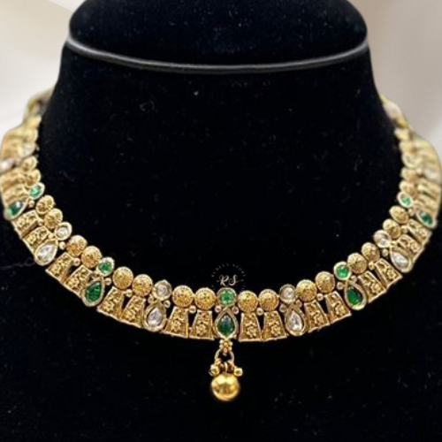 Elegant Golden Silk Set with Green Kundan